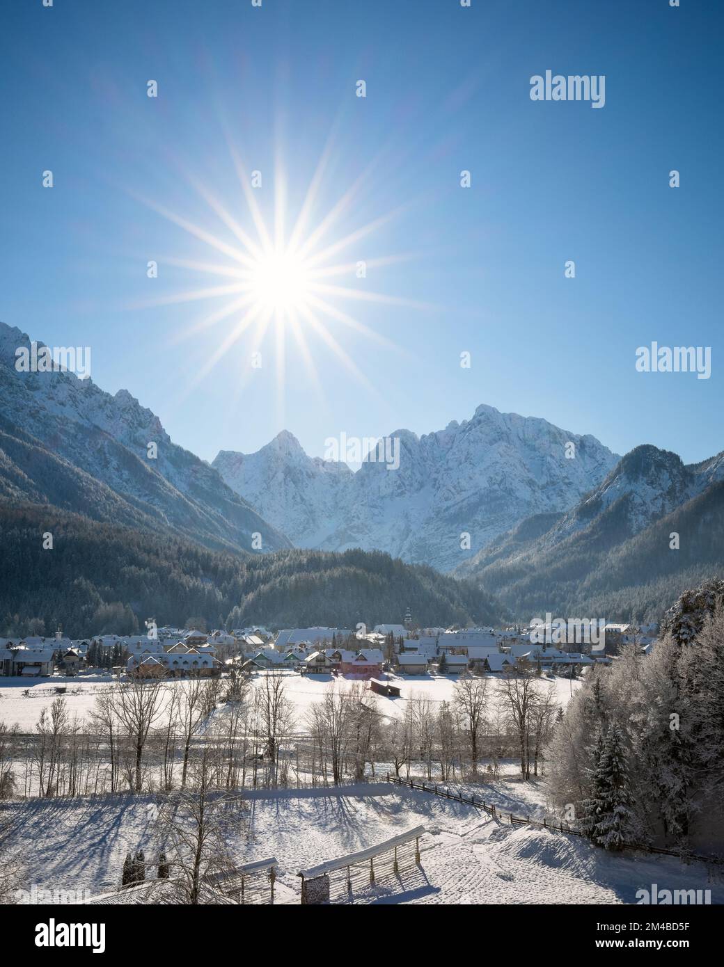 Kranjska Gora in Slovenia covered in snow at winter with Julian Alps and Triglav National Park in the background Stock Photo