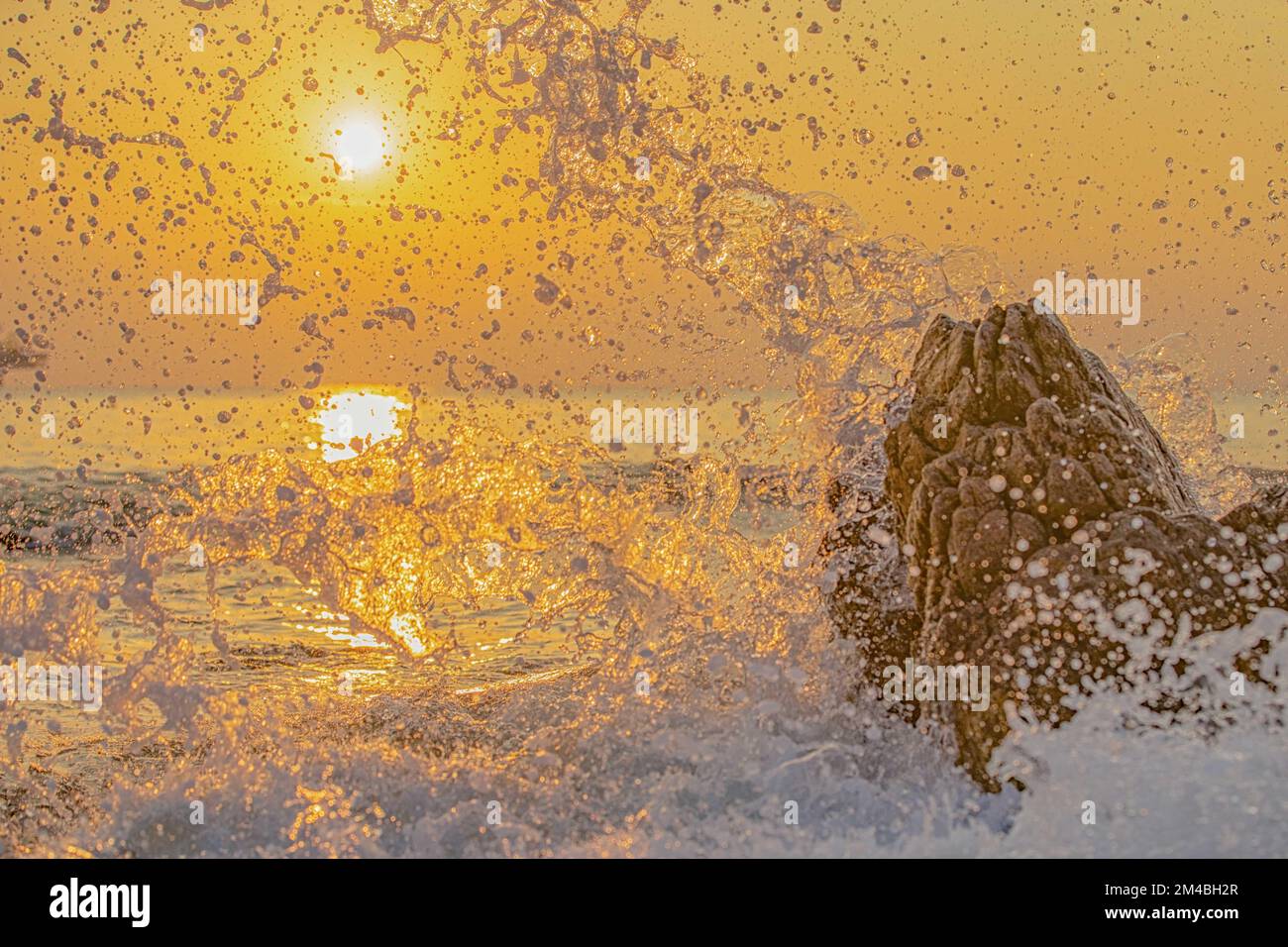 Rock splashing in water hi-res stock photography and images - Alamy