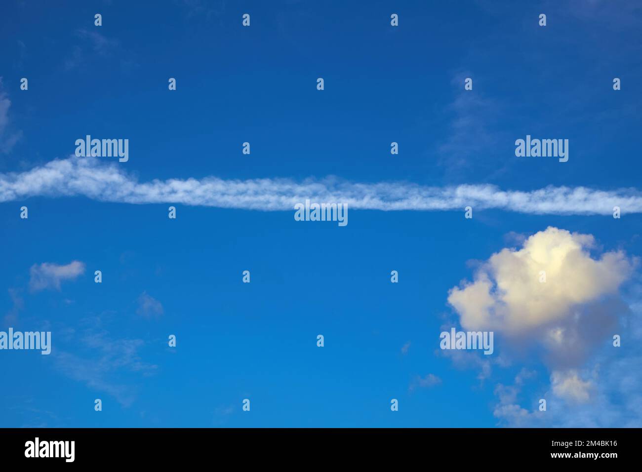 Jet plane contrails , Contrails, blue sky, clouds, sky signs Stock Photo