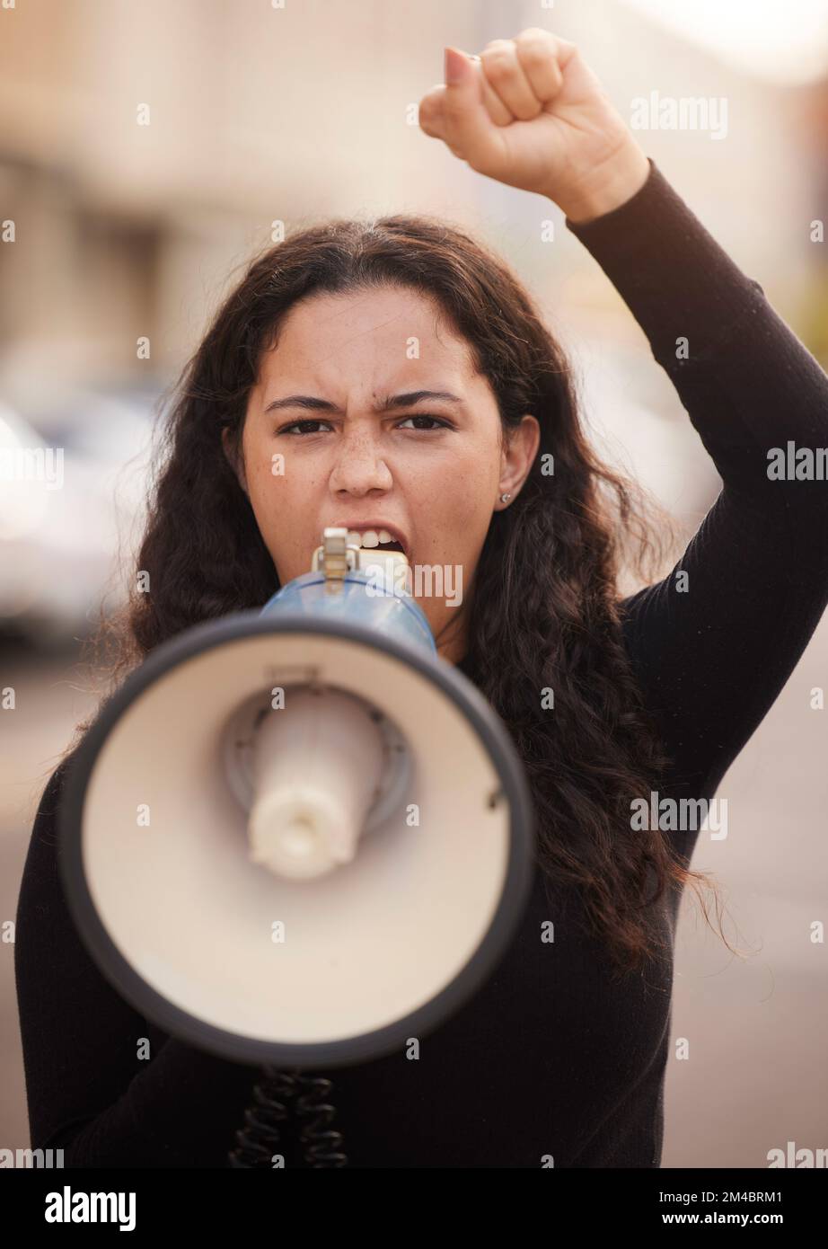Woman, face and megaphone for protest in city street for human rights ...