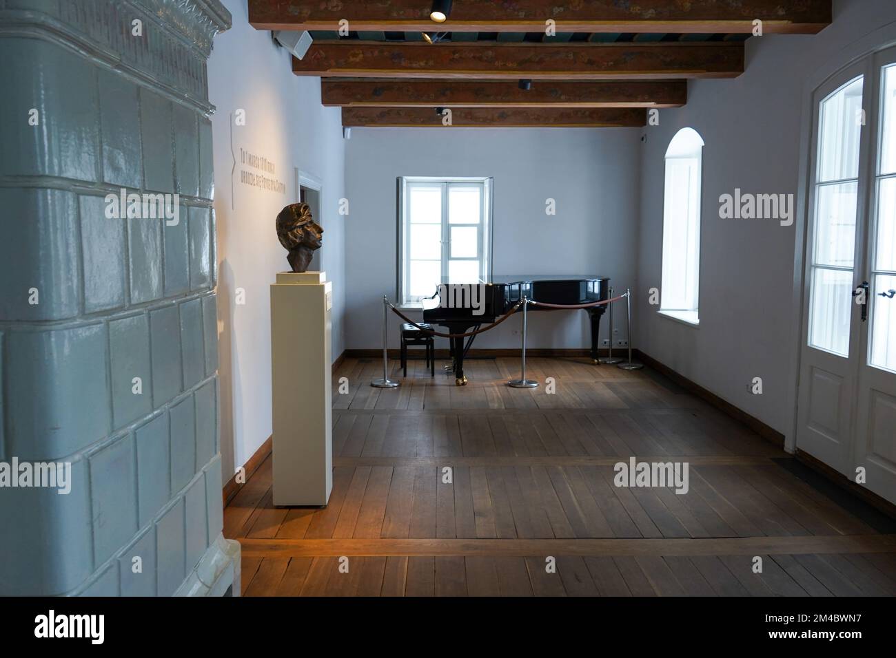 Room where Frederic Chopin was born in Birthplace of Chopin in Żelazowa Wola, Poland with bronze sculpture of composer head by Xavery Dunikowski Stock Photo