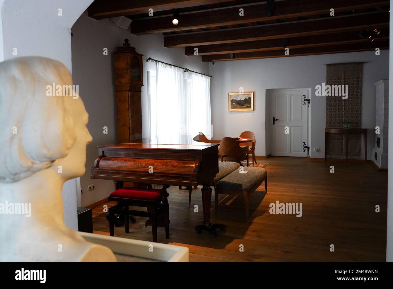 Room in old manor-house which is the Birthplace of Frederic Chopin in Zelazowa Wola, Poland. There's  brown 19th century Erard - period piano. Stock Photo