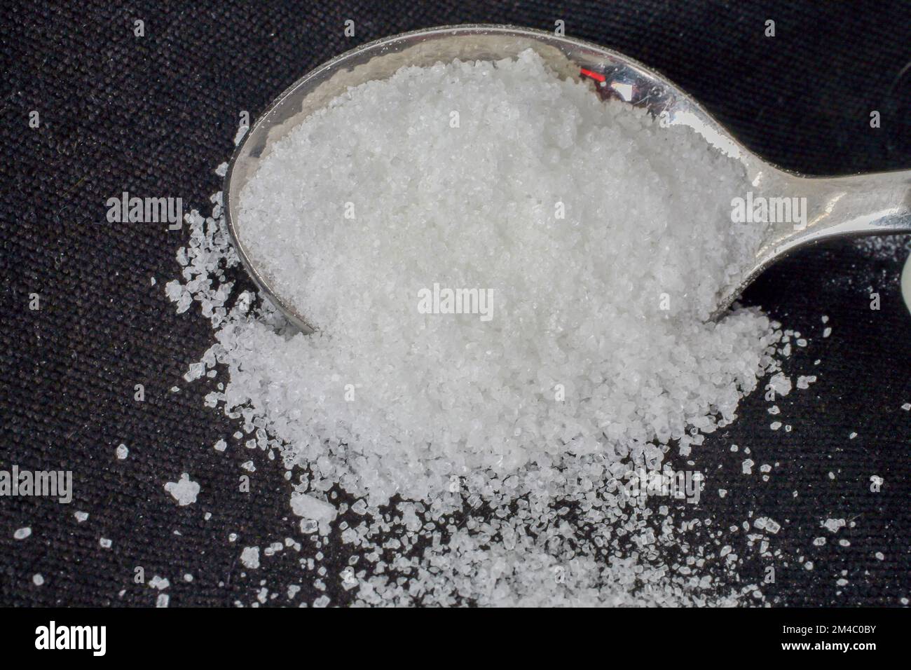 White refined sugar on a spoon Stock Photo