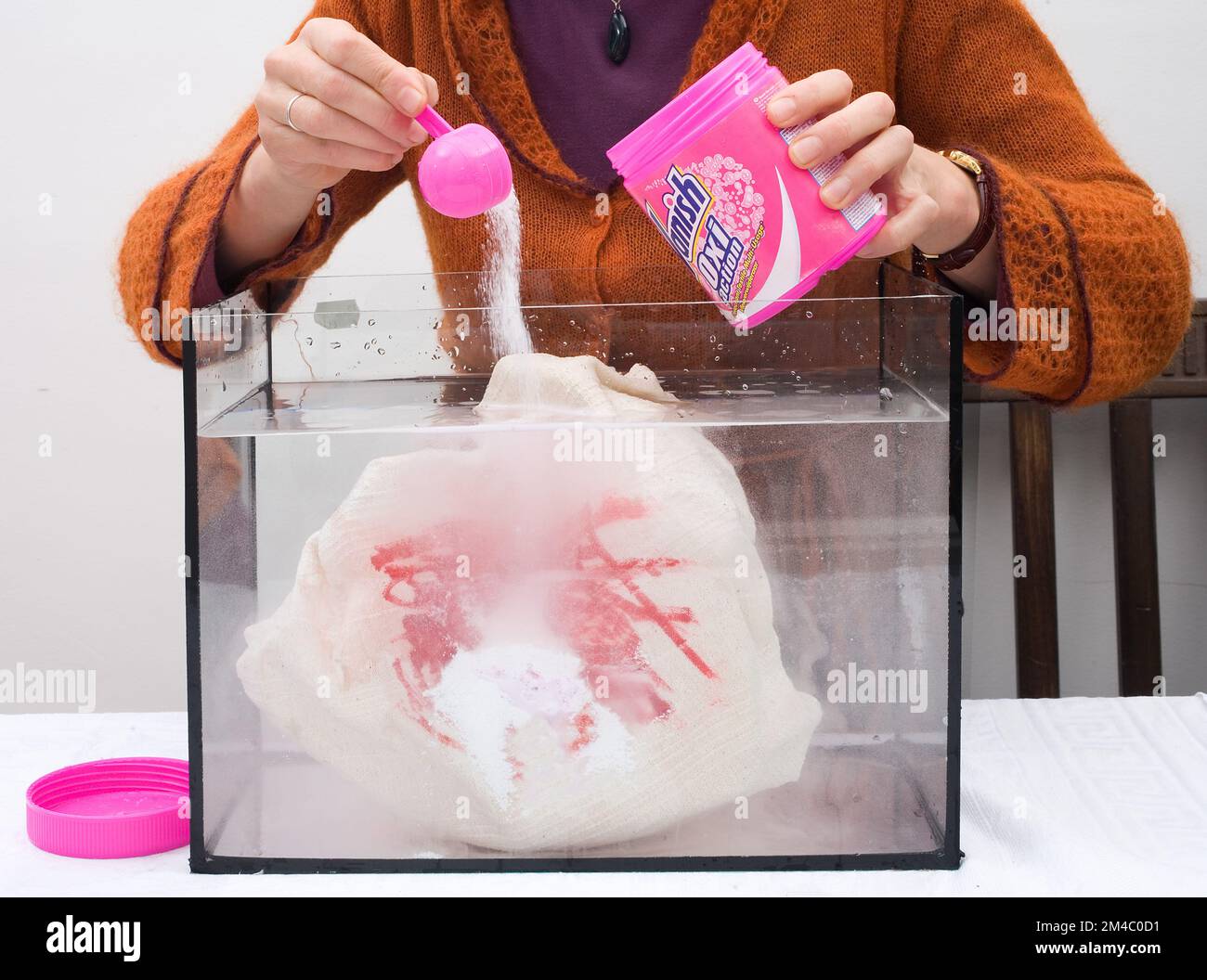 woman shows the effect of washing powder Stock Photo