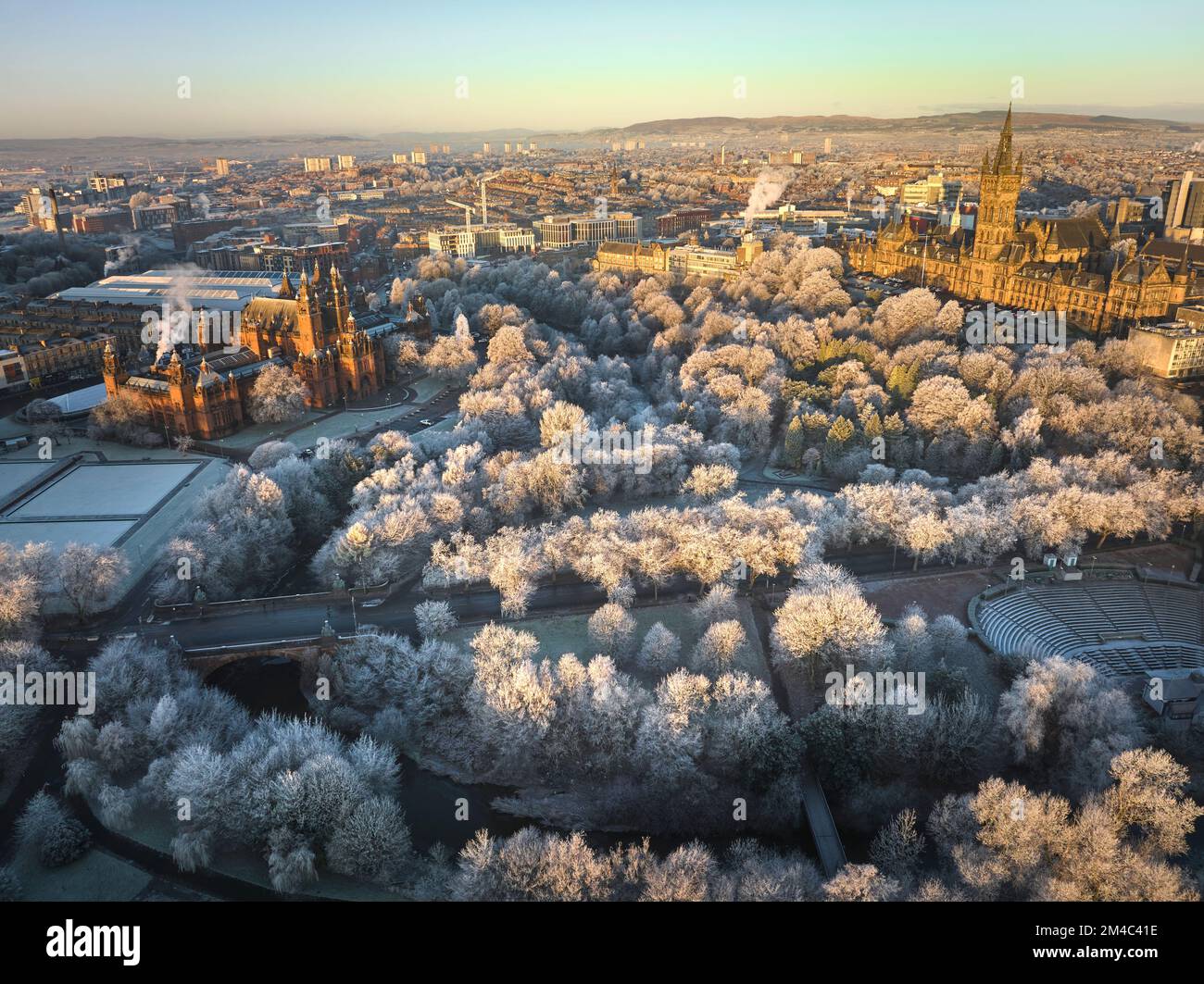 Aerial shot of University of Glasgow and Kelvingrove Art Gallery and Museum with the trees in Kelvingrove Park covered by hoarfrost in December. Stock Photo