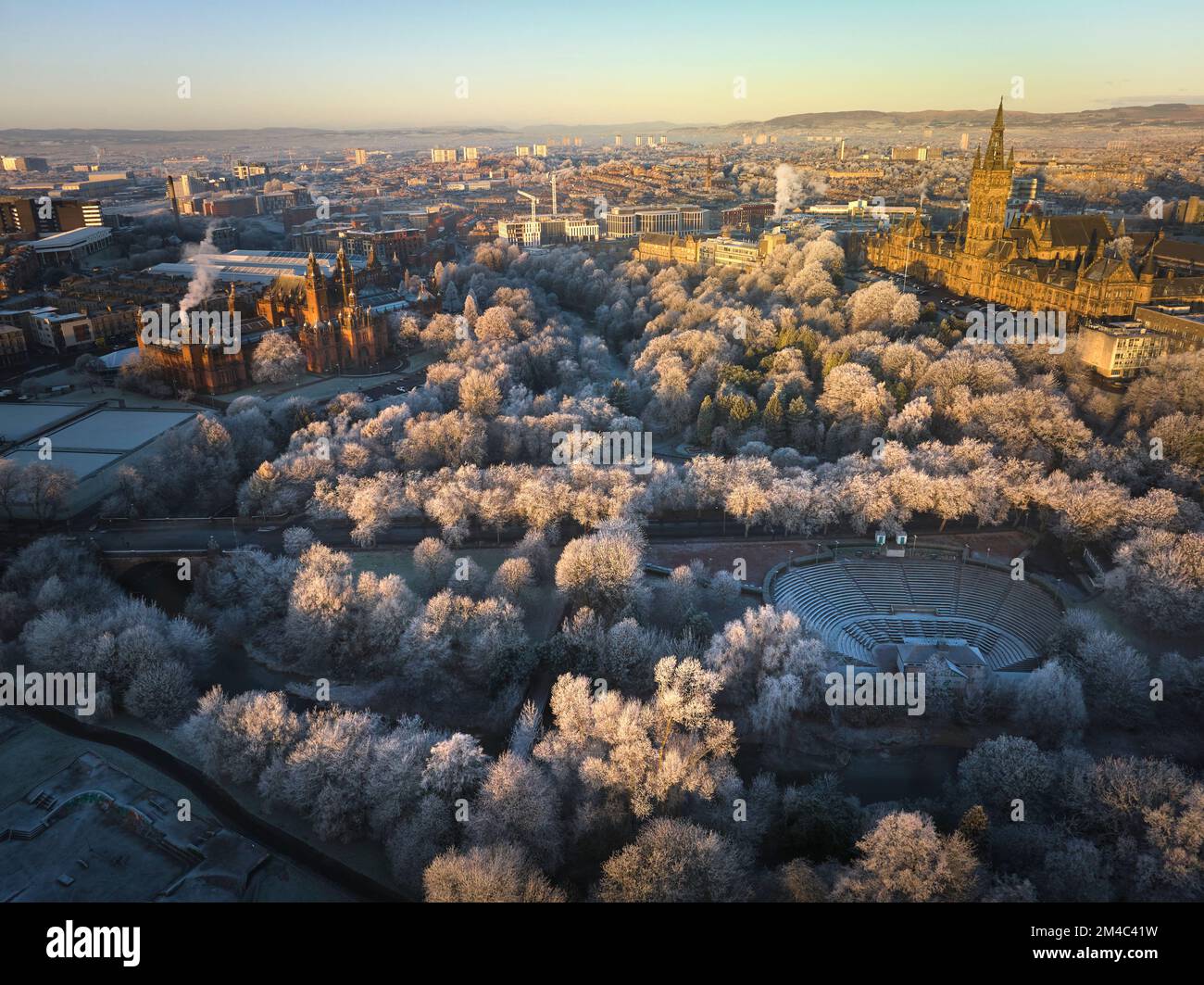 Aerial shot of University of Glasgow and Kelvingrove Art Gallery and Museum with the trees in Kelvingrove Park covered by hoarfrost in December. Stock Photo