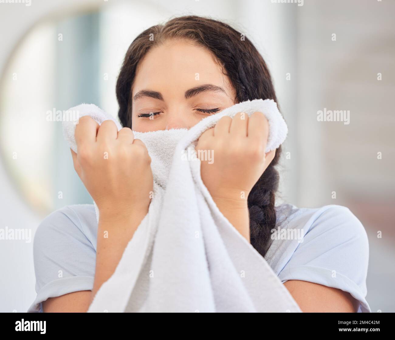 Woman, smell towel or laundry with fresh fabric, clean cloth and