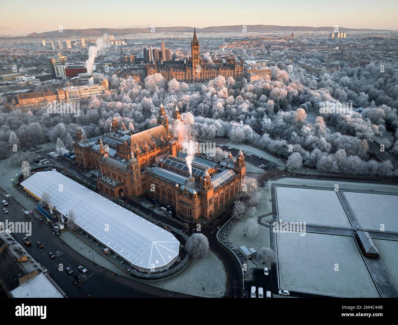 Aerial shot of University of Glasgow and Kelvingrove Art Gallery and Museum with the trees in Kelvingrove Park covered by hoarfrost in December. Stock Photo