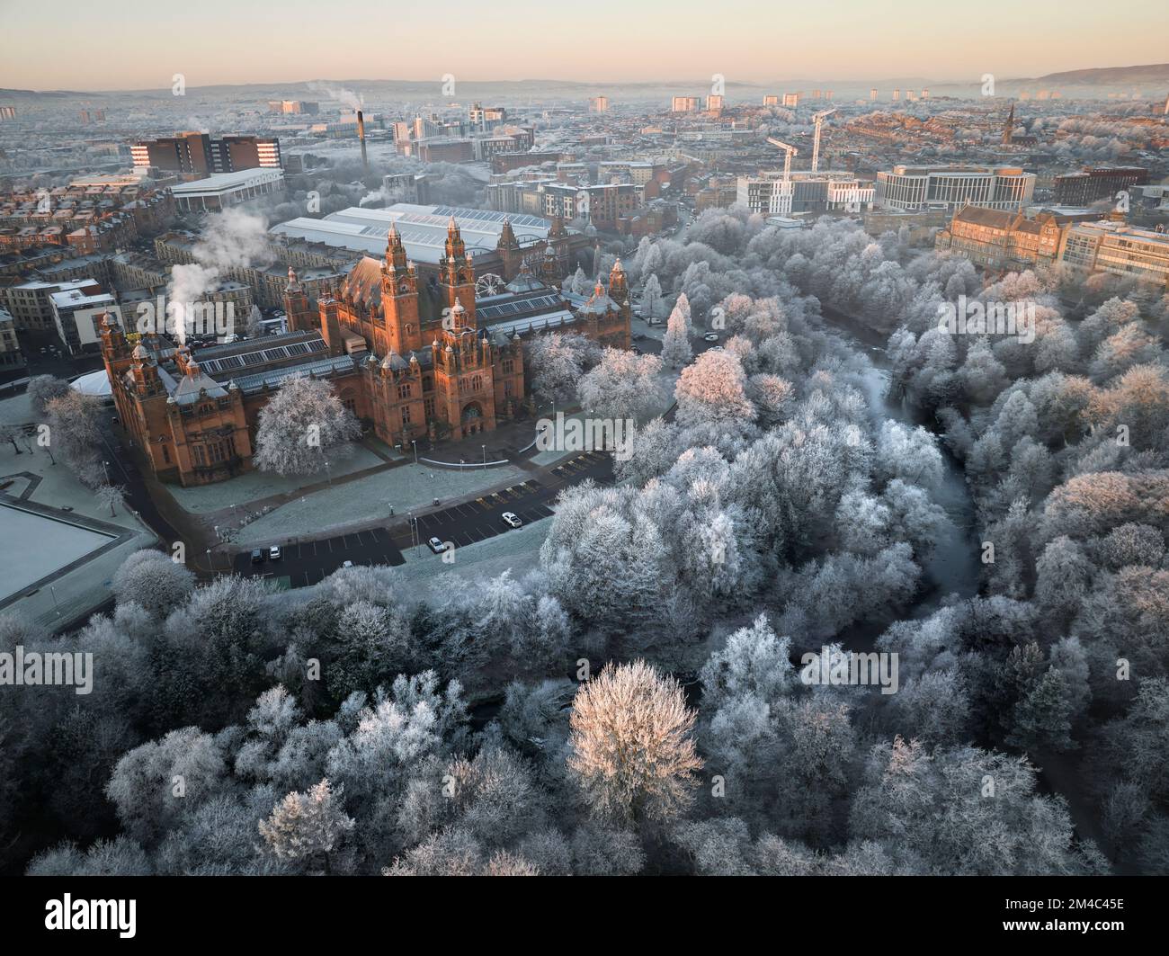Aerial shot of Kelvingrove Art Gallery and Museum in Glasgow with a hoarfrost covering the trees in Kelvingrove Park on a crisp winters day. Stock Photo