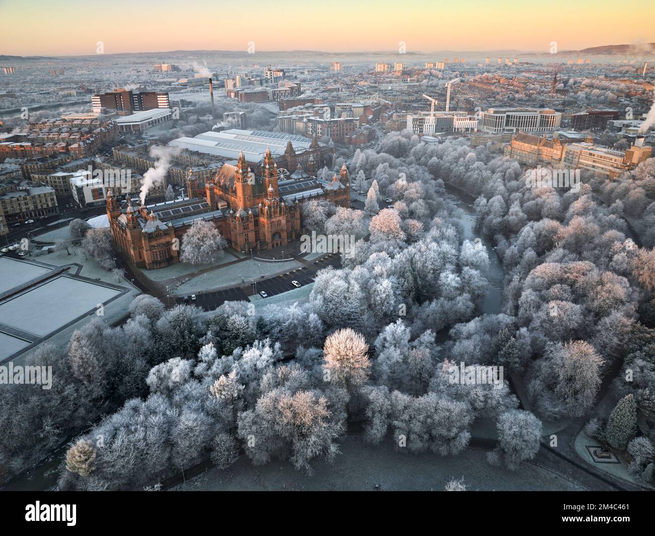 Aerial shot of Kelvingrove Art Gallery and Museum in Glasgow with a hoarfrost covering the trees in Kelvingrove Park on a crisp winters day. Stock Photo
