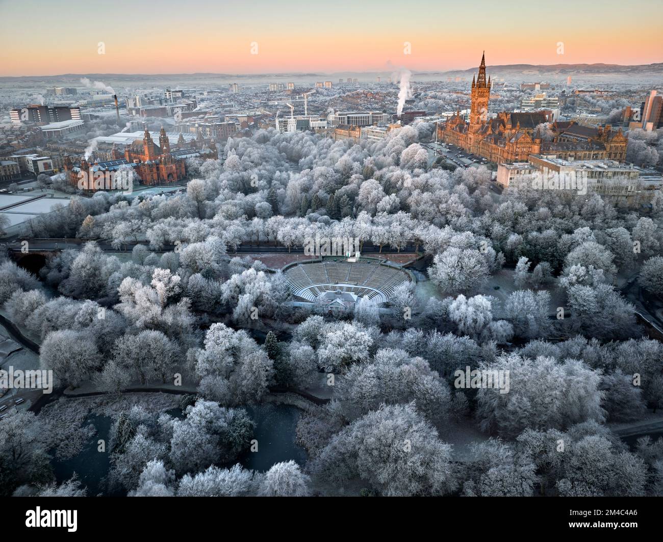 Aerial shot of University of Glasgow and Kelvingrove Art Gallery and Museum with the trees in Kelvingrove Park covered by hoarfrost in December. Stock Photo