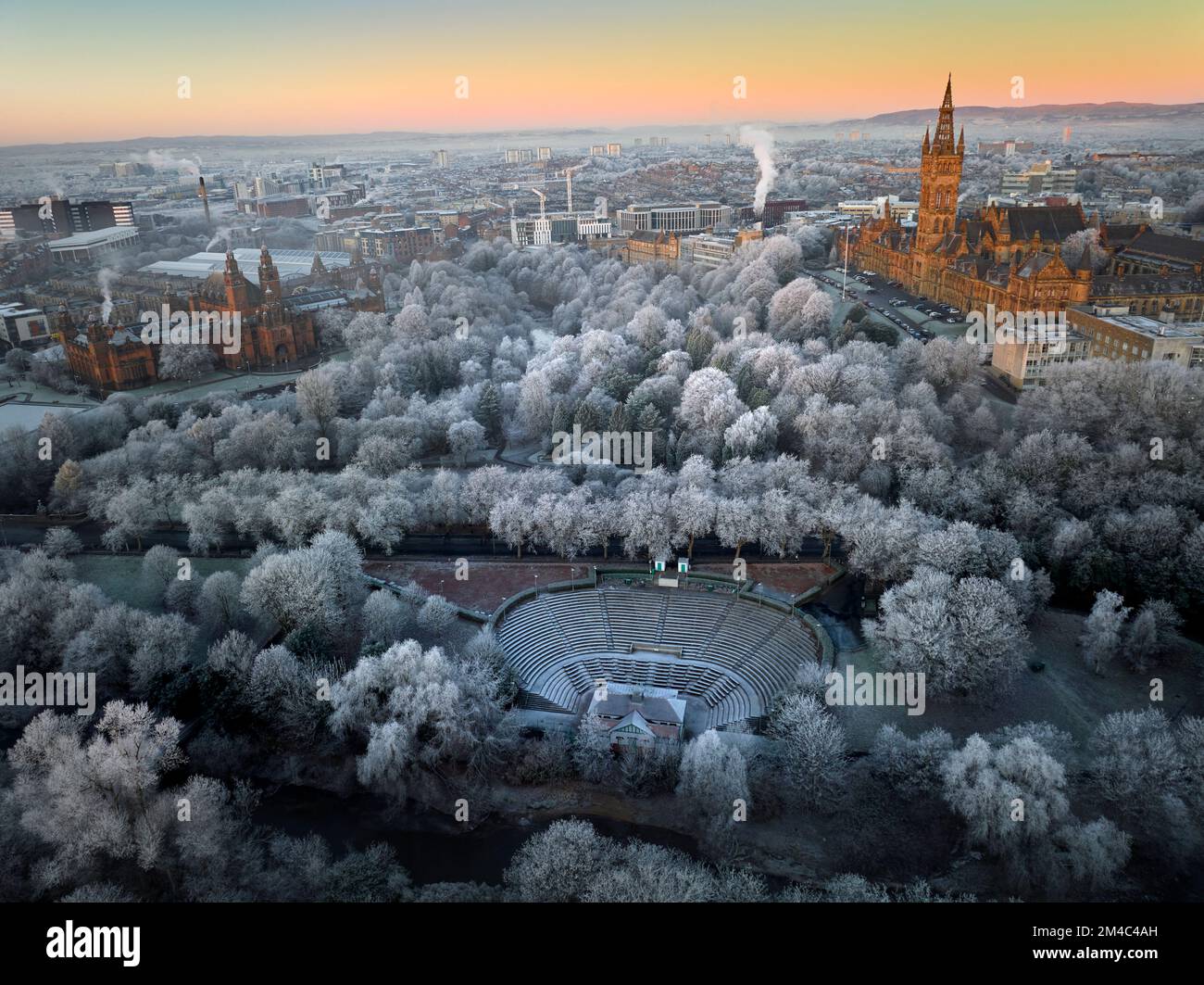 Aerial shot of University of Glasgow and Kelvingrove Art Gallery and Museum with the trees in Kelvingrove Park covered by hoarfrost in December. Stock Photo