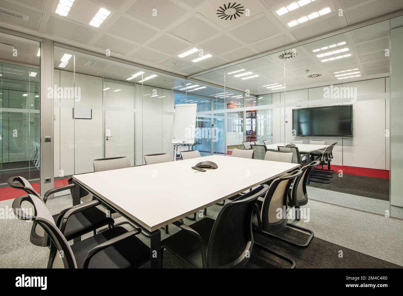 A meeting table in a coworking office with glass partitions Stock Photo Alamy