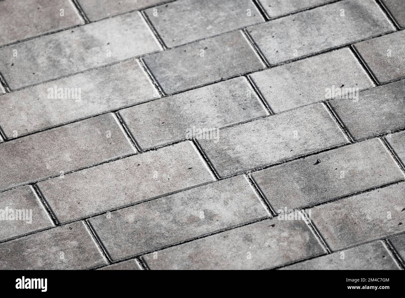 Gray concrete cobble road background, paving slabs pattern Stock Photo