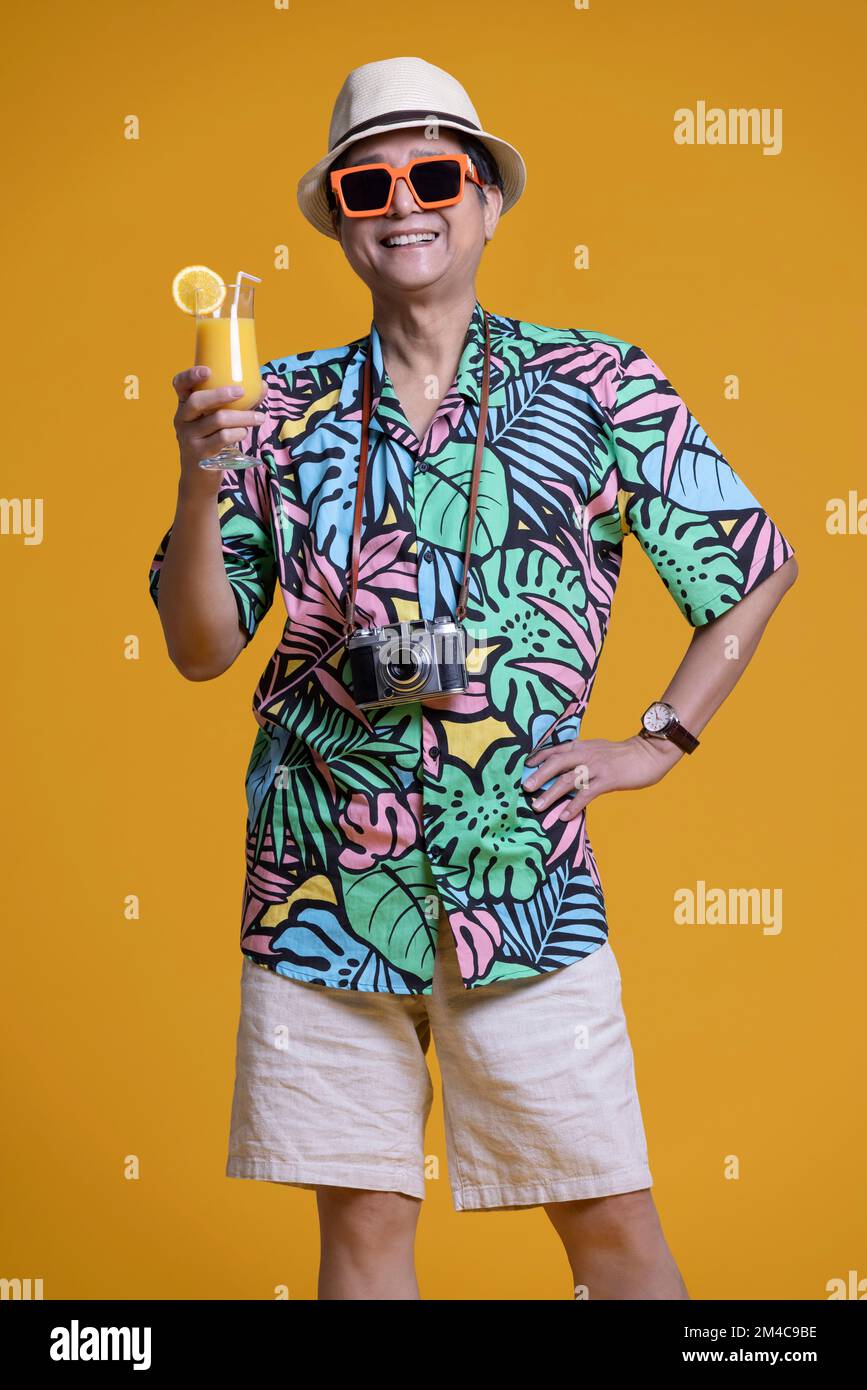 Cheerful Man In Hawaiian Shirt And Shorts High-Res Stock Photo