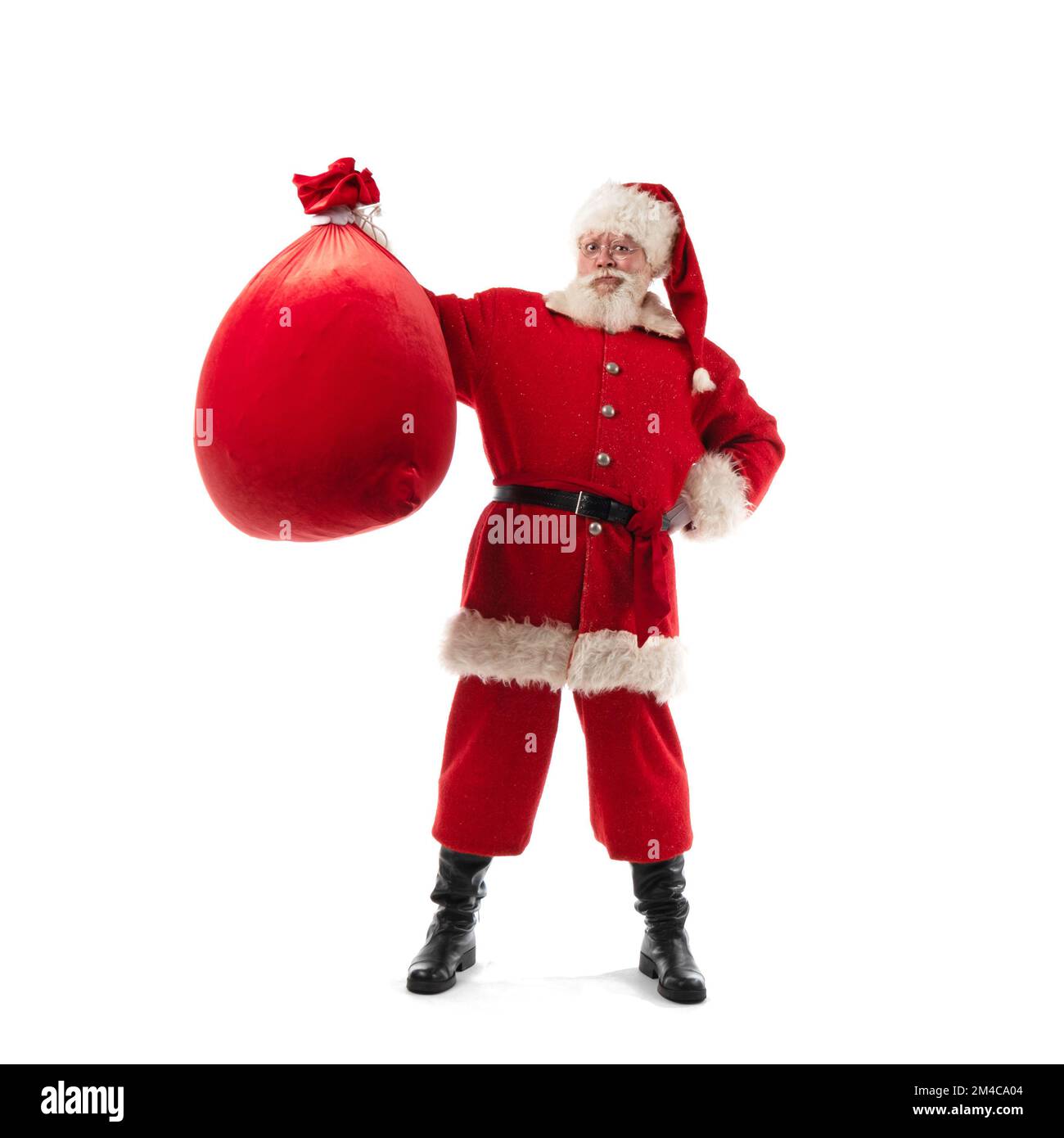 Santa Claus shows Christmas gift bag isolated on white background Stock ...