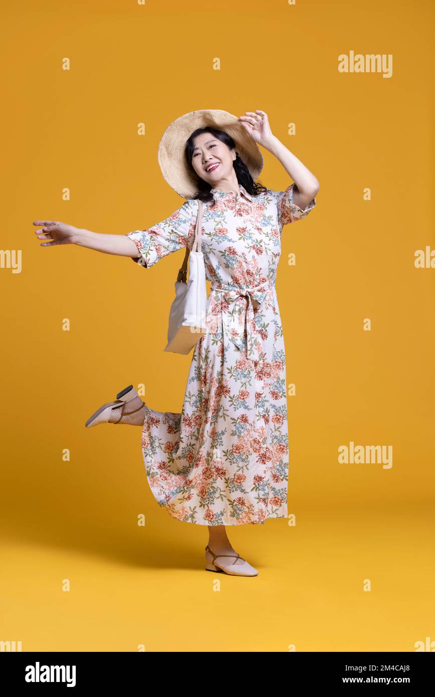 Woman in dress arms outstretched hi-res stock photography and images ...