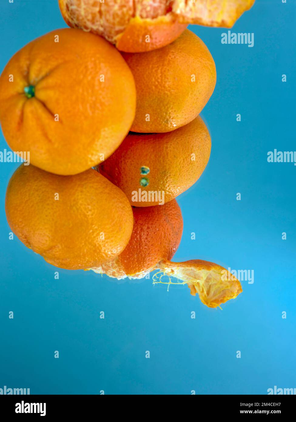 Easy peel sweet Tangerines on clean neutral background. Natural close