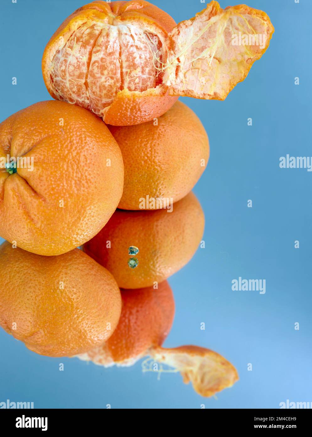Easy peel sweet Tangerines on clean neutral background. Natural close