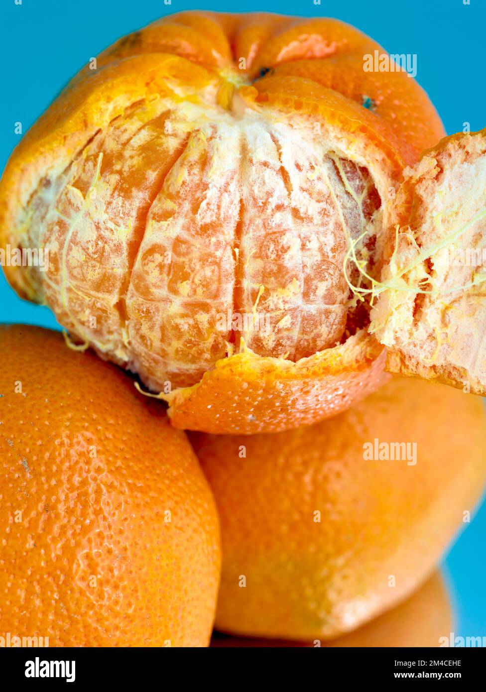 Easy peel sweet Tangerines on clean neutral background. Natural close
