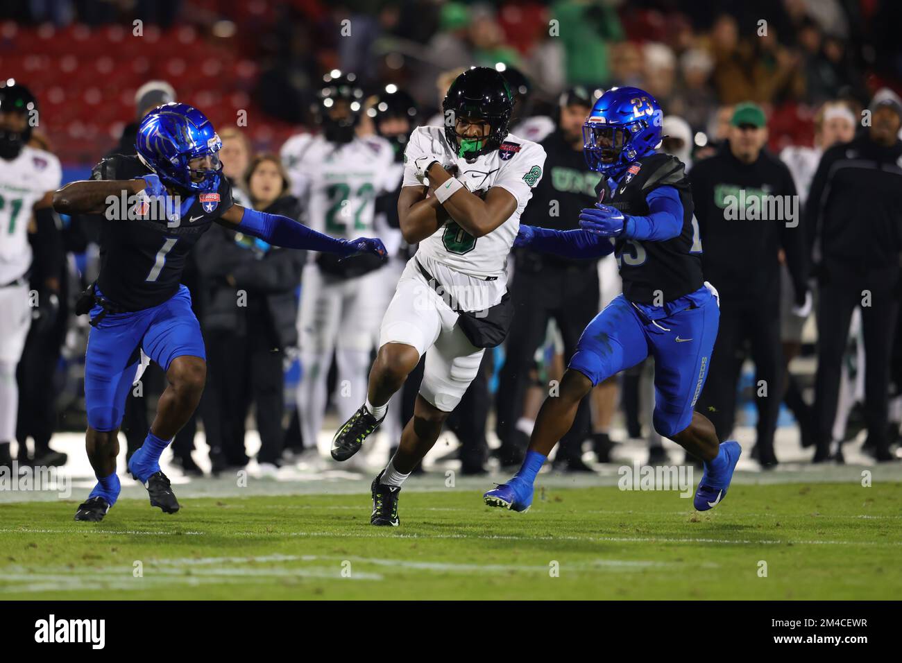 North Texas Mean Green wide receiver Damon Ward Jr. (8) is brought down by Boise State Broncos cornerback Caleb Biggers (1) and safety Seyi Oladipo (2 Stock Photo