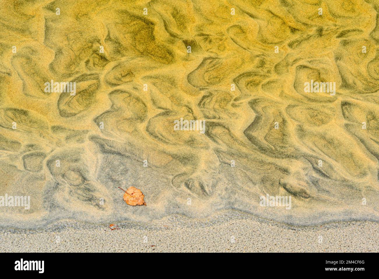 Sand erosion patterns in a small creek entering Sandy Beach, Wawa