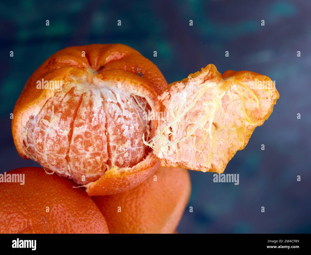 Easy peel sweet Tangerines on clean neutral background. Natural close up fruit portrait Stock