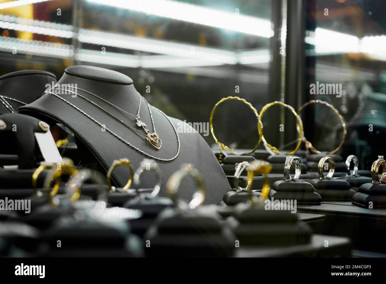 Gold jewelry diamond shop with rings and heart shape necklaces in