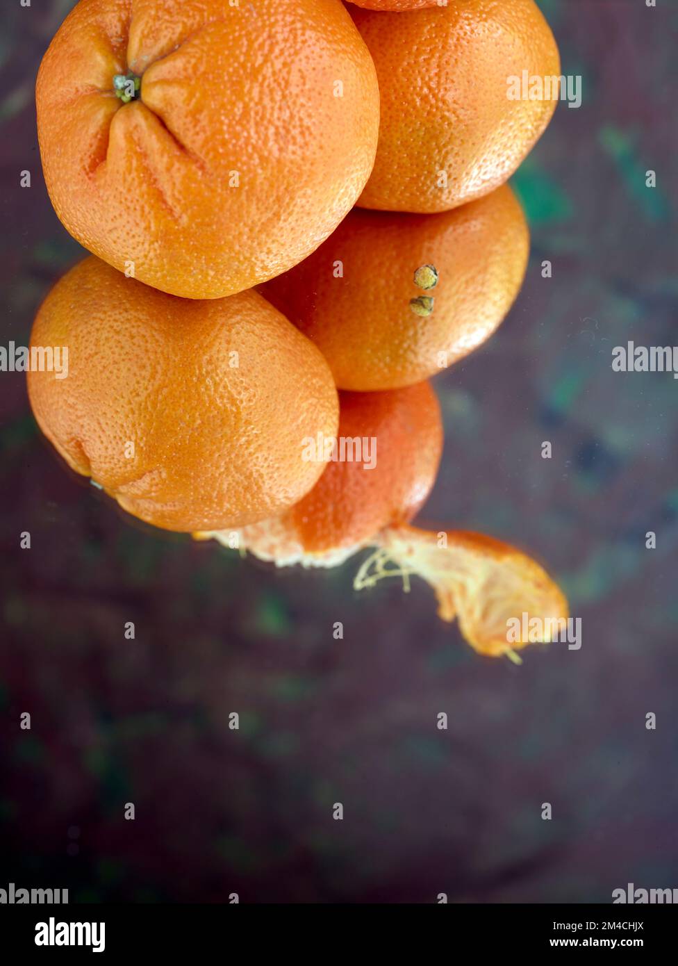 Easy peel sweet Tangerines on clean neutral background. Natural close