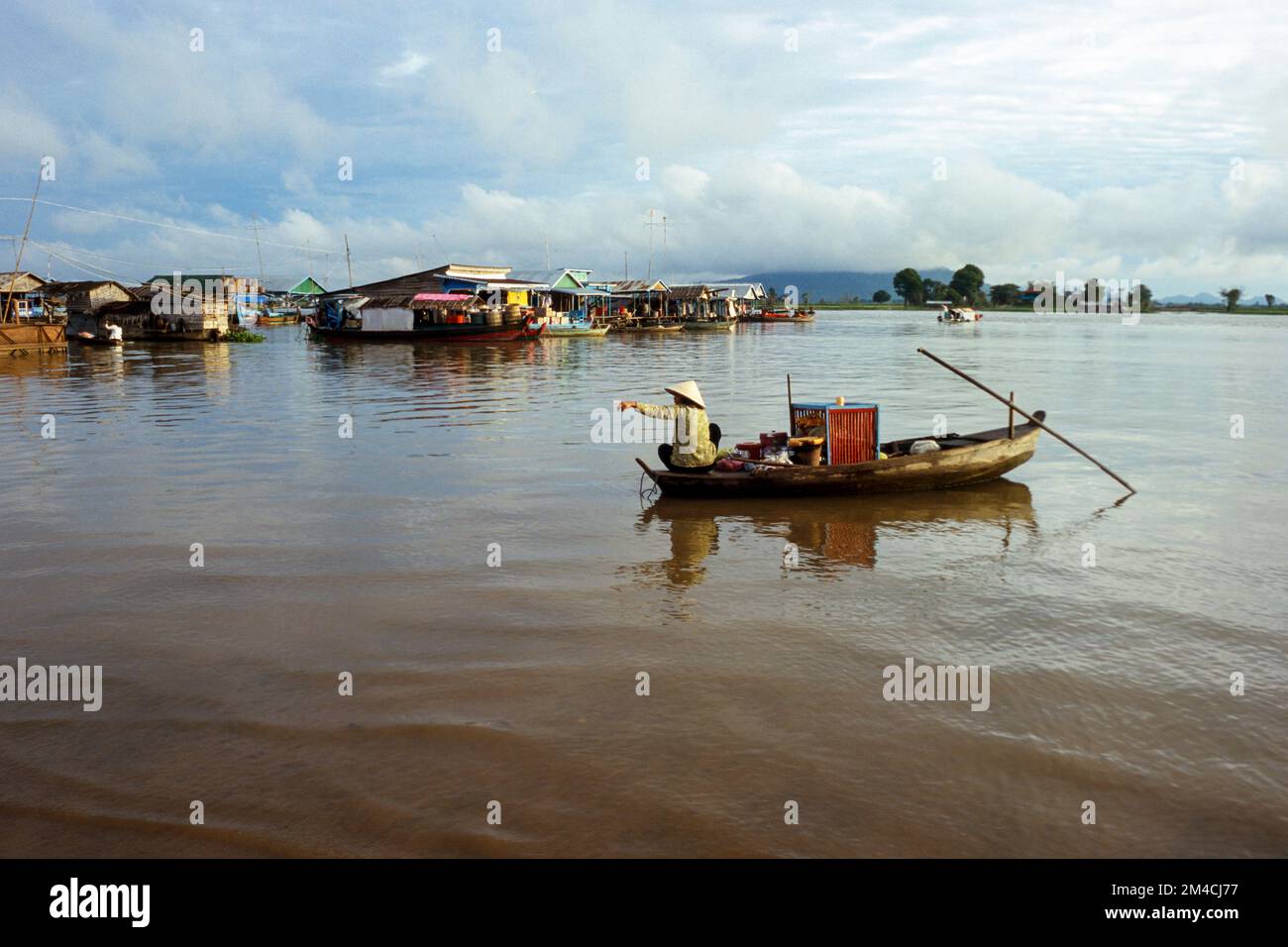 Boots are the way to carry goods across the Tonle Sap River Stock Photo