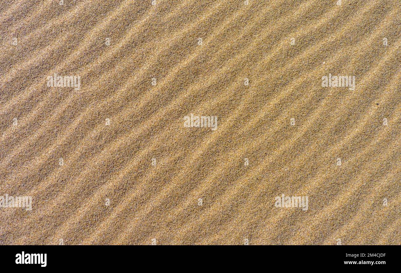 Texture or pattern of rippled sand Stock Photo