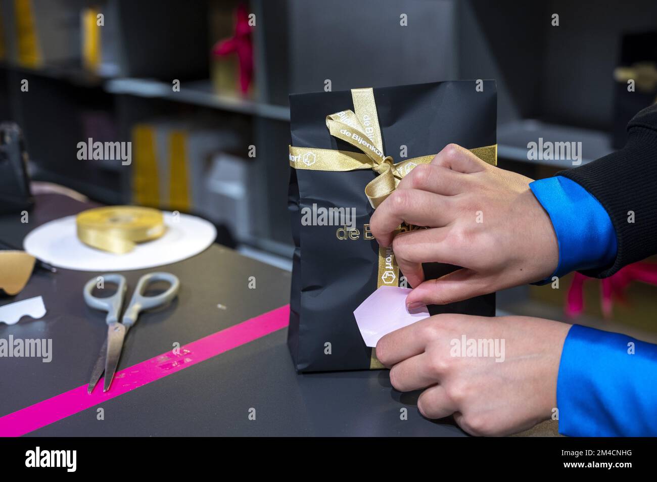AMSTERDAM Christmas gifts are wrapped in a department store in the