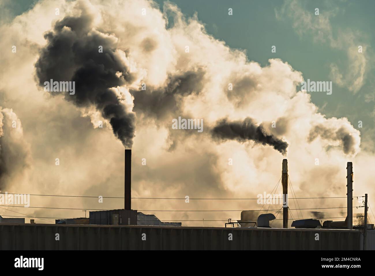 Smoke and fumes emitted from factory smokestacks Stock Photo Alamy