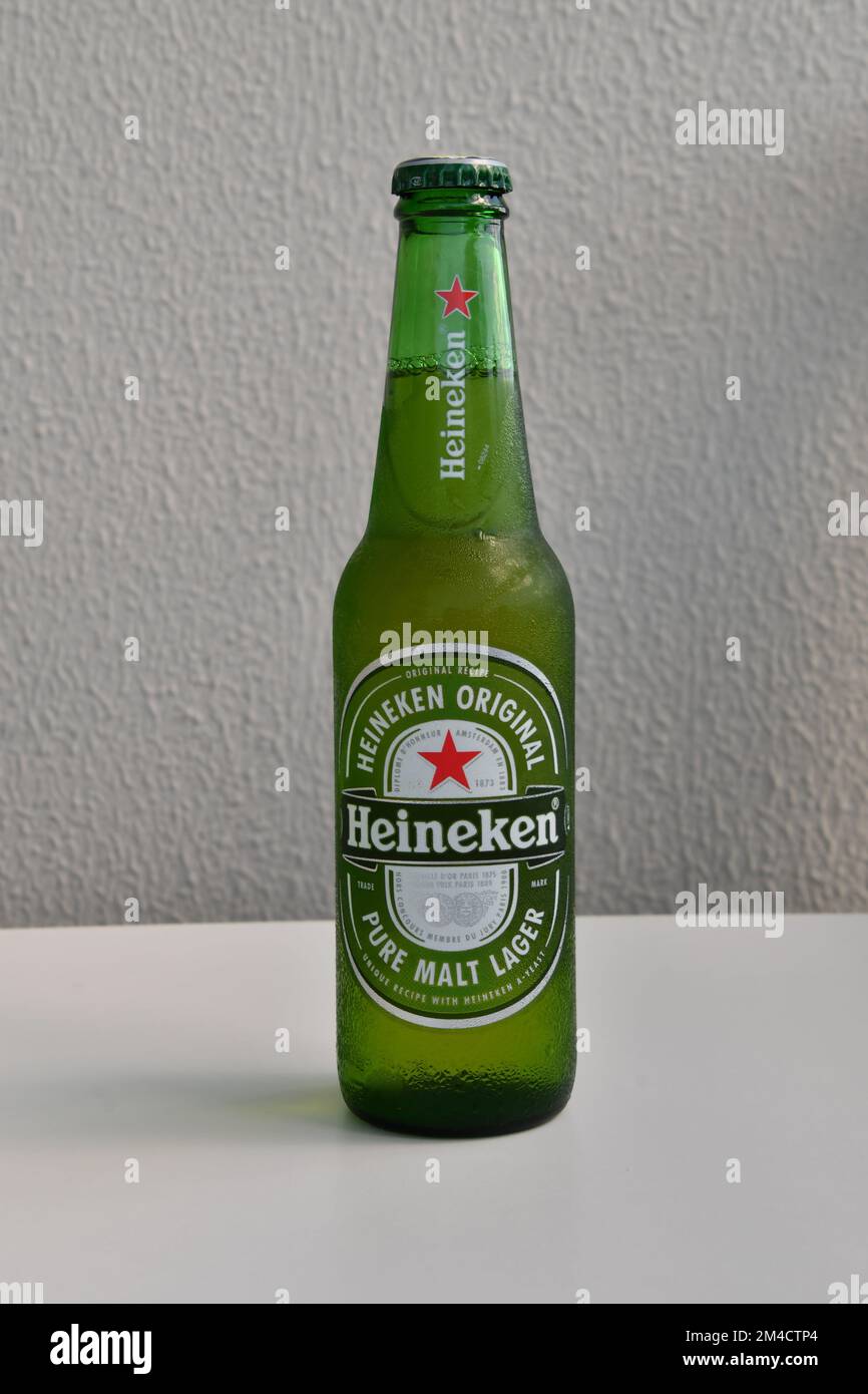 a bottle of cold Heineken beer on the isolated background Stock Photo