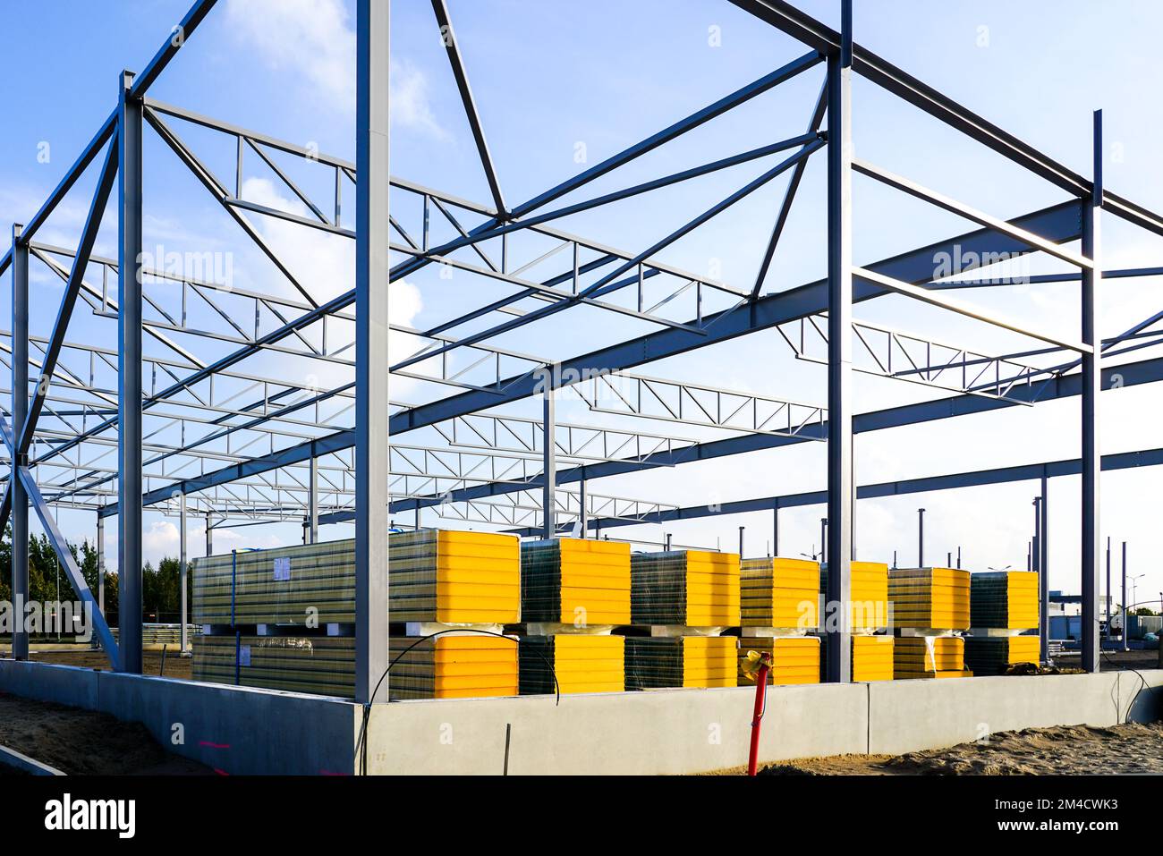 Assembled steel frame and stacks of sandwich panels for the facade of a ...