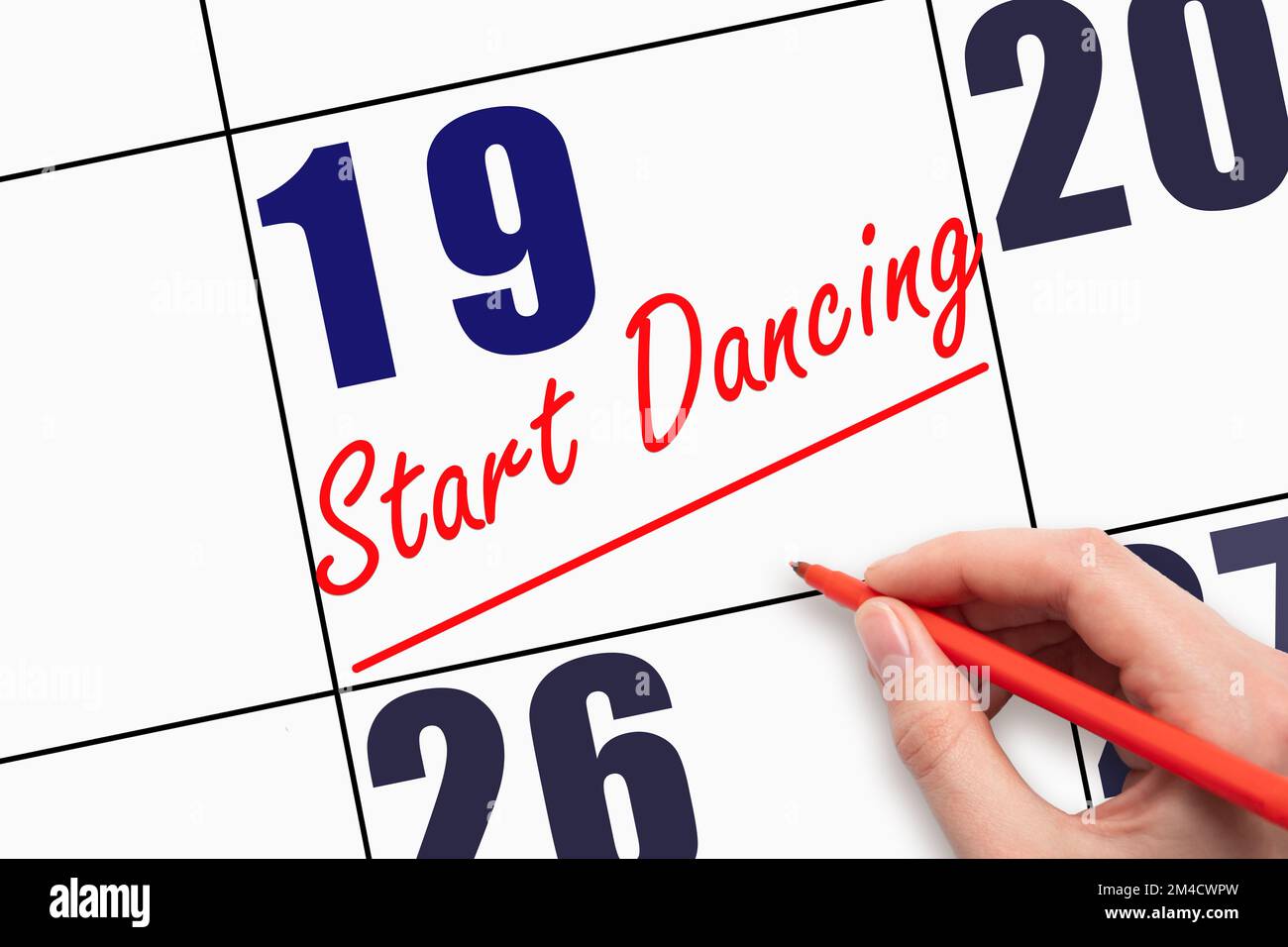 19th day of the month. Hand writing text START DANCING and drawing a ...