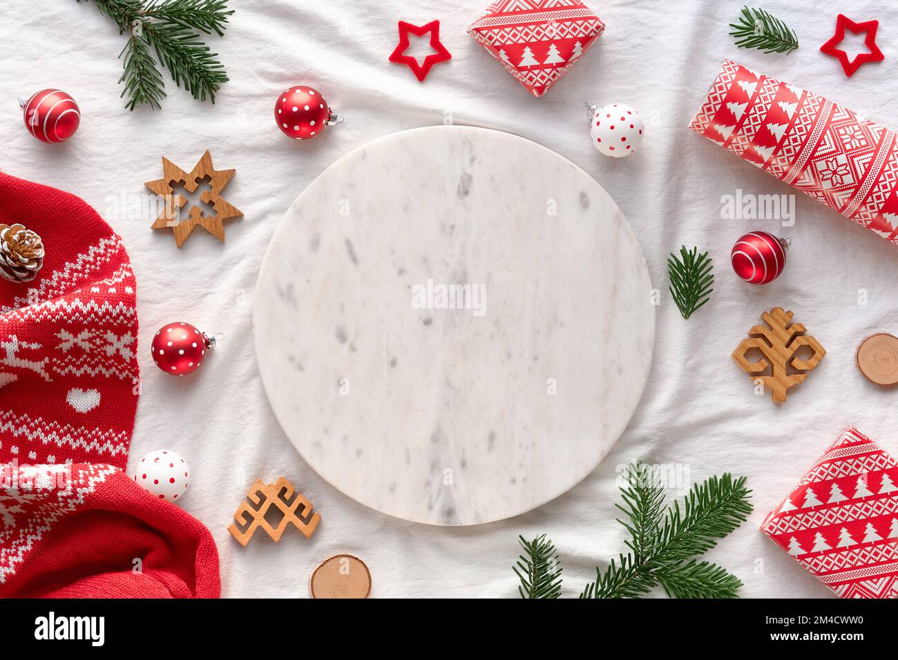 Latvian Yule, Christmas. Ethnographic symbols and patterns from Latvia, wood amulets, wrapping paper, gift boxes with fir tree and berries. Baltic Stock Photo