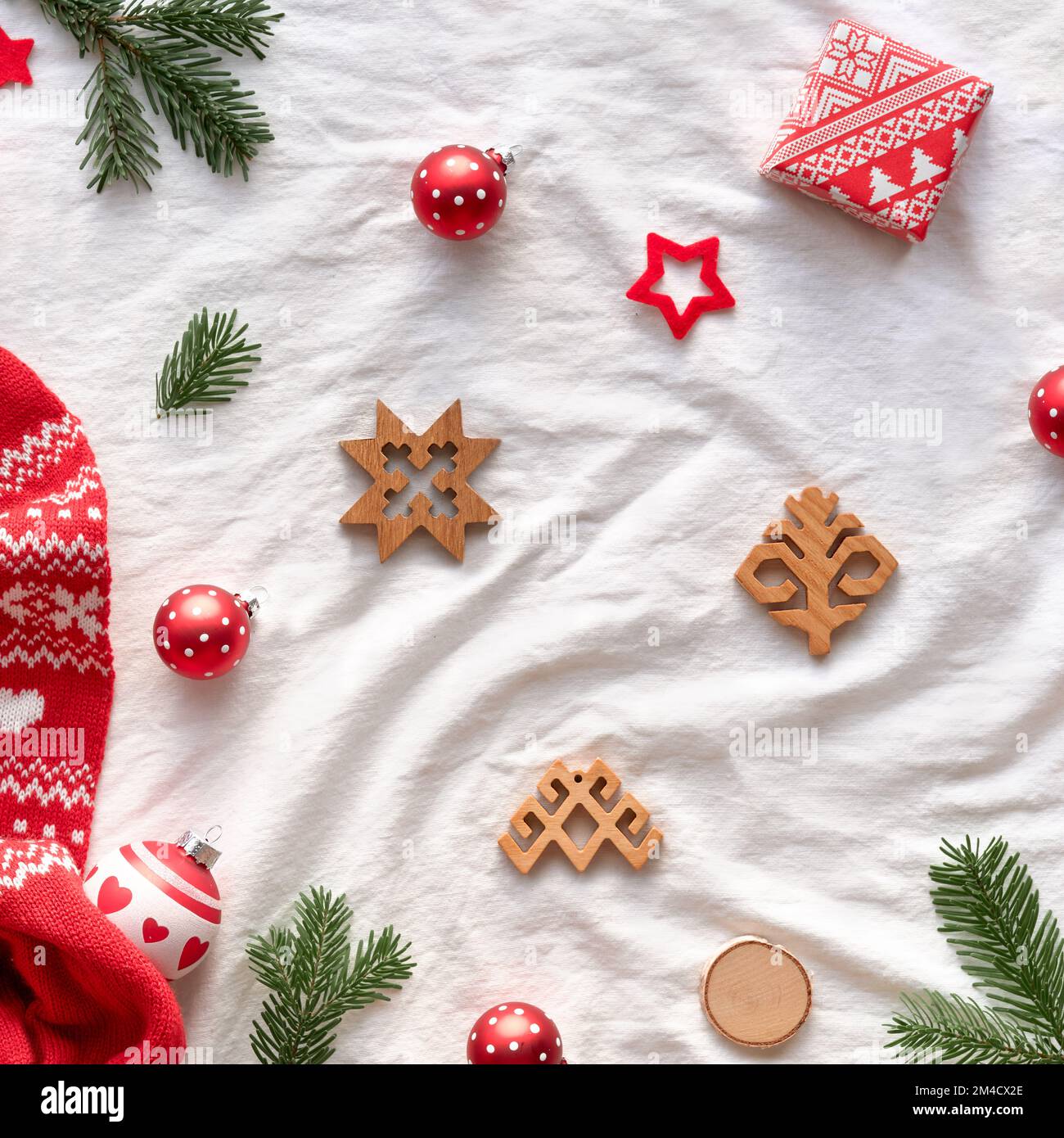 Latvian Yule, Christmas. Ethnographic symbols and patterns from Latvia, wood amulets, wrapping paper, gift boxes with fir tree and berries. Baltic Stock Photo