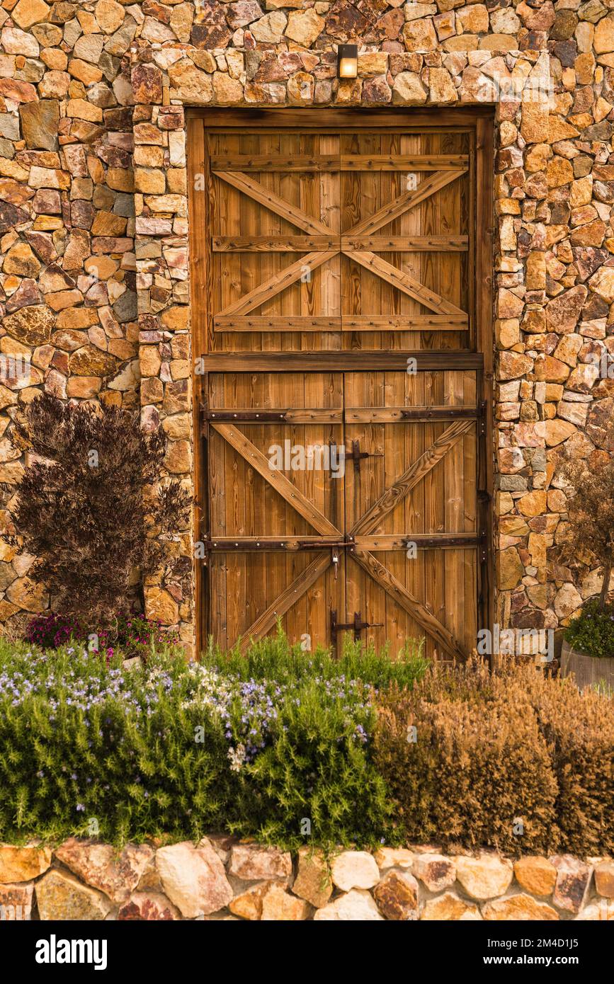 Background photo of a stone wall and wooden door Stock Photo - Alamy