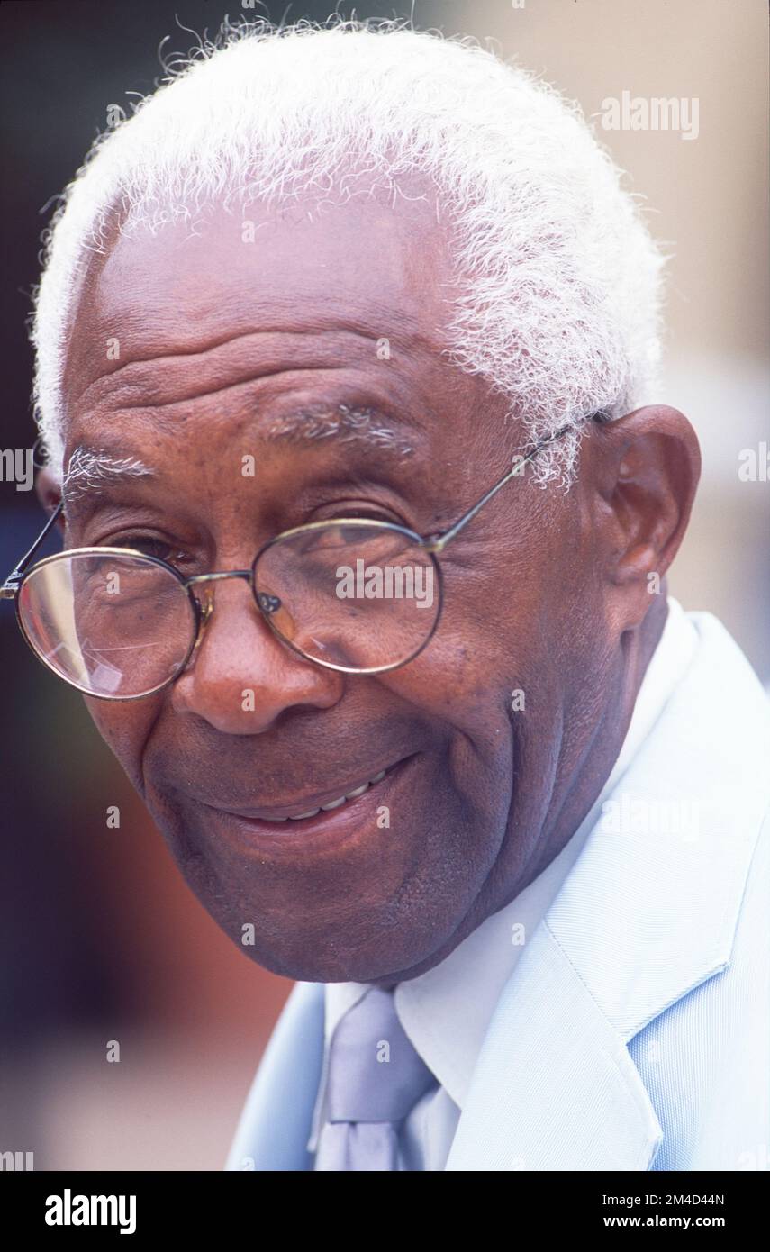 Close-up shot of an African American older gentleman with glasses, smiling Stock Photo