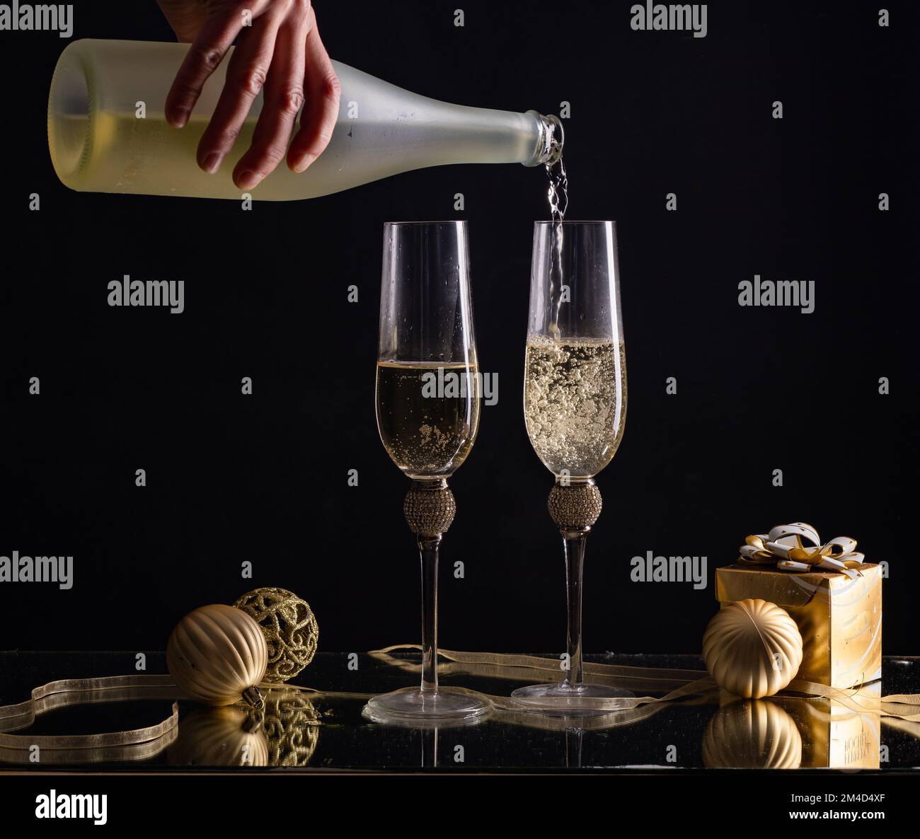 two champagne glasses New Year background Stock Photo - Alamy