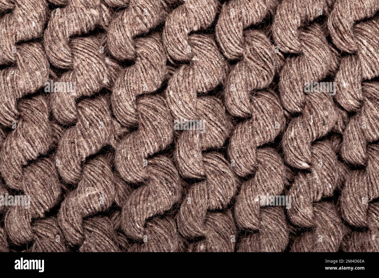 Knit Texture Of Light Natural Wool Knitted Fabric With Cable