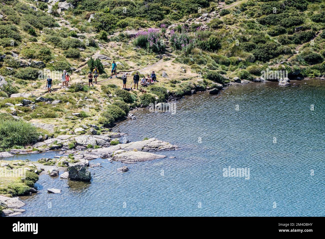 Panoramic view, Estany primer, with a group of people, Ordino Arcalis, Andorra Stock Photo