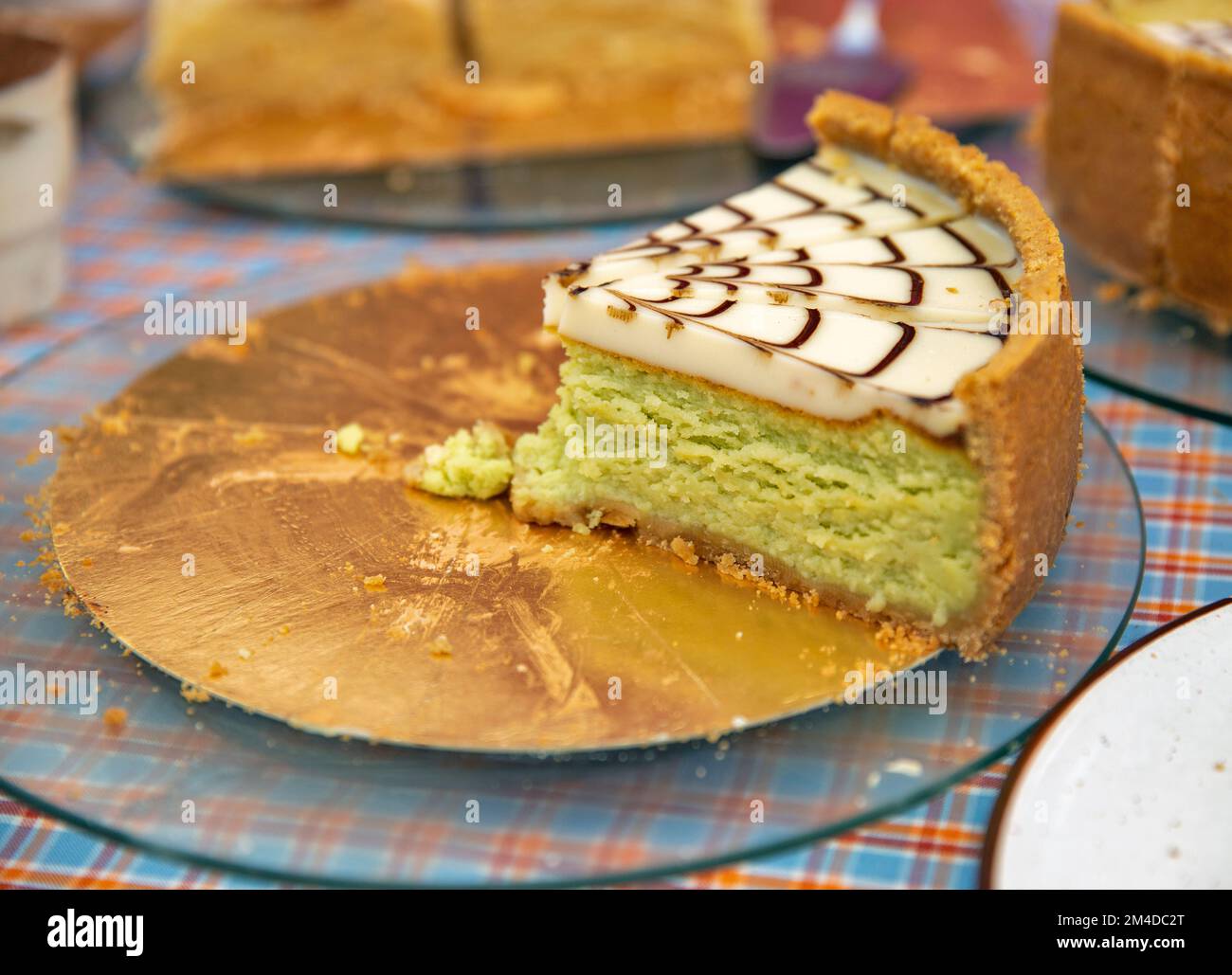a piece of cream cake with pistachio filling closeup Stock Photo