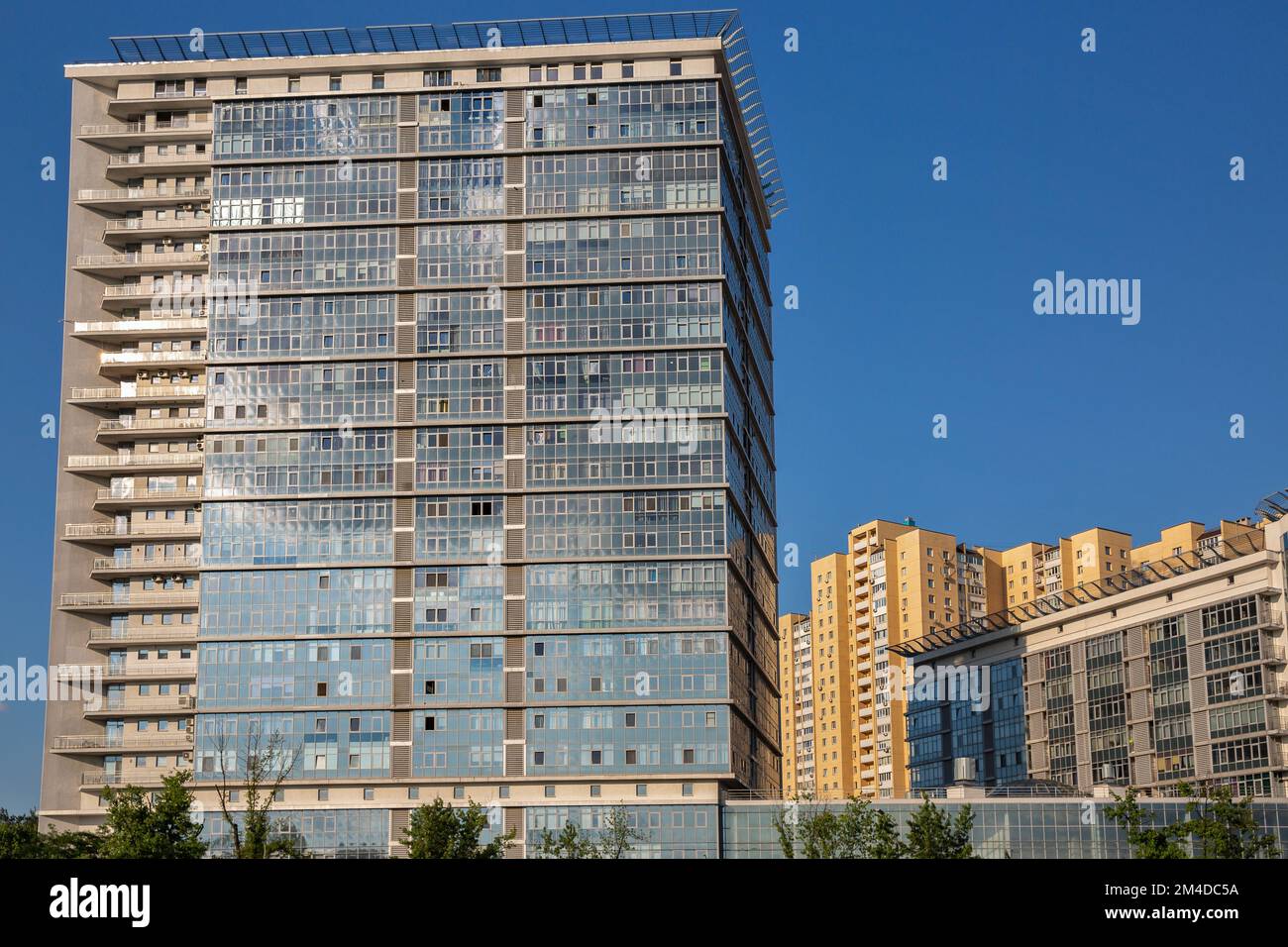 Generic modern office building at sunny day in downtown Stock Photo