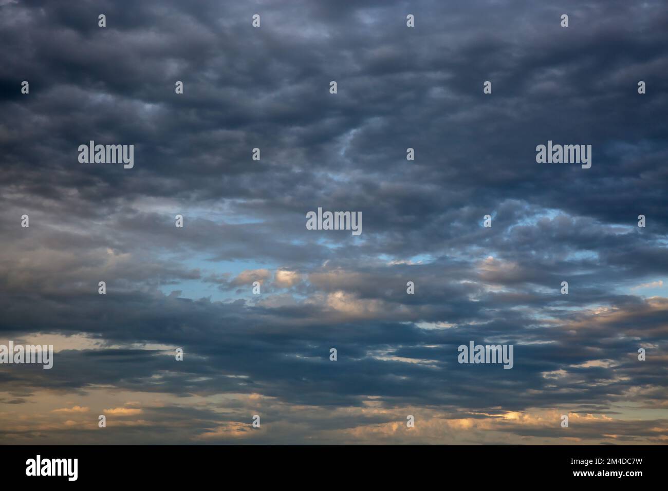 Dramatic cloudscape with blue sky and dark clouds Stock Photo