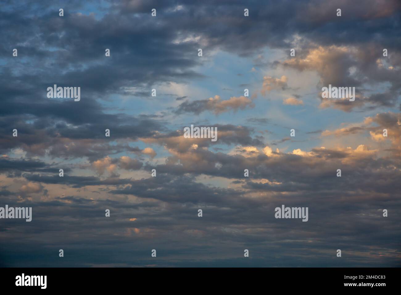 Dramatic cloudscape with blue sky and dark clouds Stock Photo - Alamy