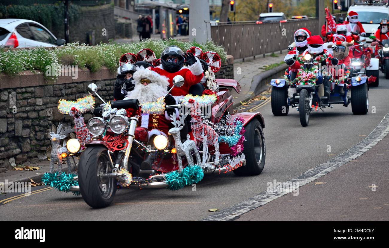 Traditional motorcycle Santa Clause children's charity grand appeal ride through city,Bristol, England Stock Photo