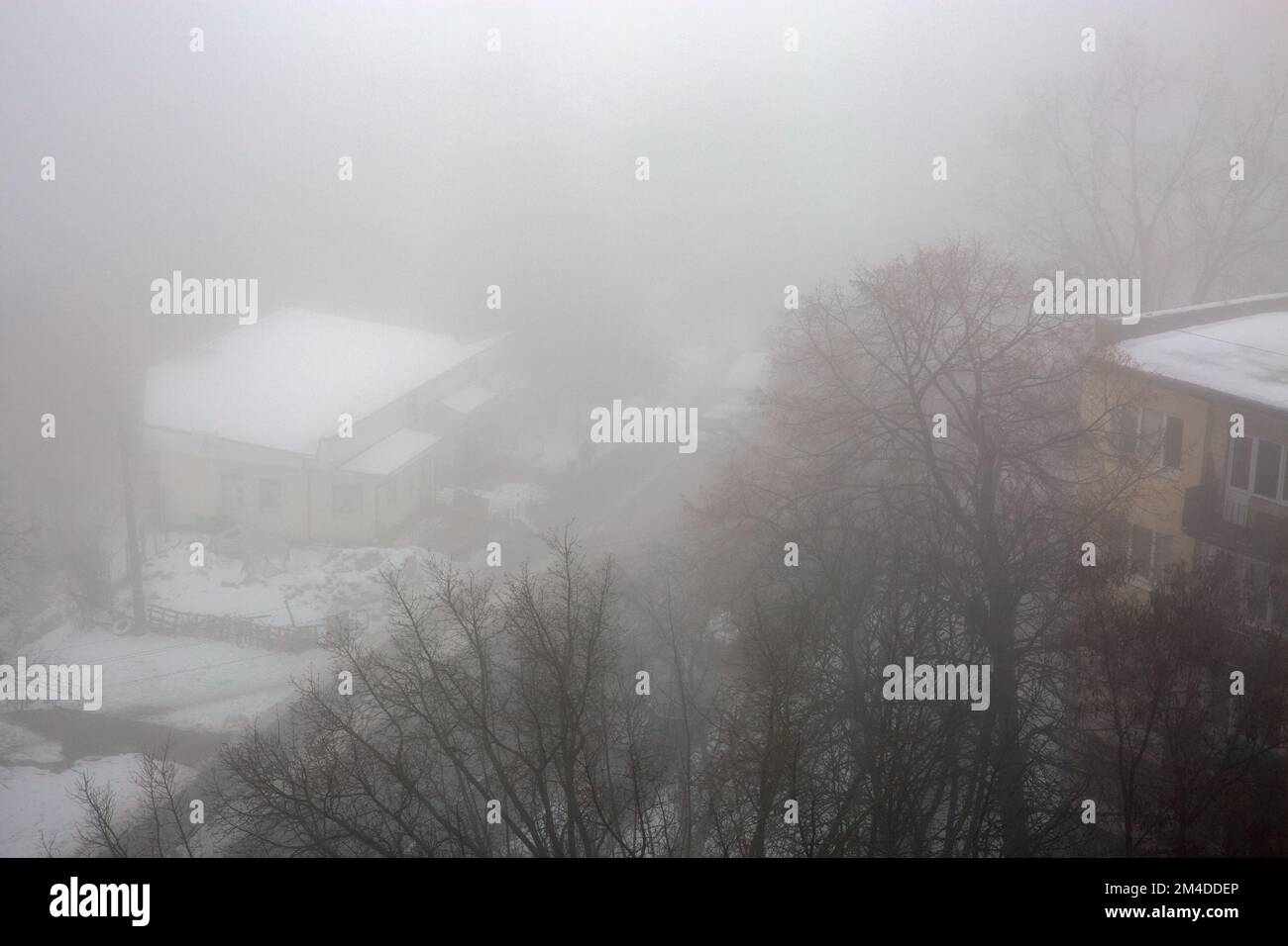 Urban landscape with very dense fog in Kyiv, Ukraine. Stock Photo