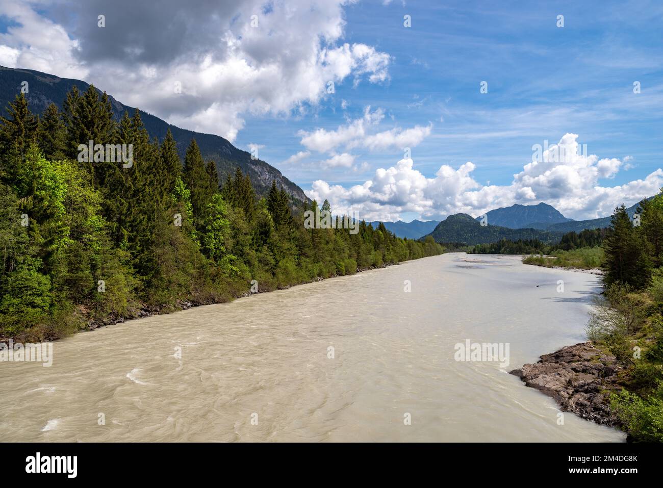 Fantastic view over the Lechtal valley with mountains in the background on a sunny day near Reutte in Tyrol. White clouds in blue sky Stock Photo